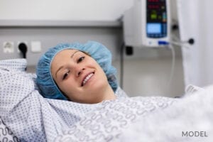 Female Resting in Recovery Bed After Tummy Tuck